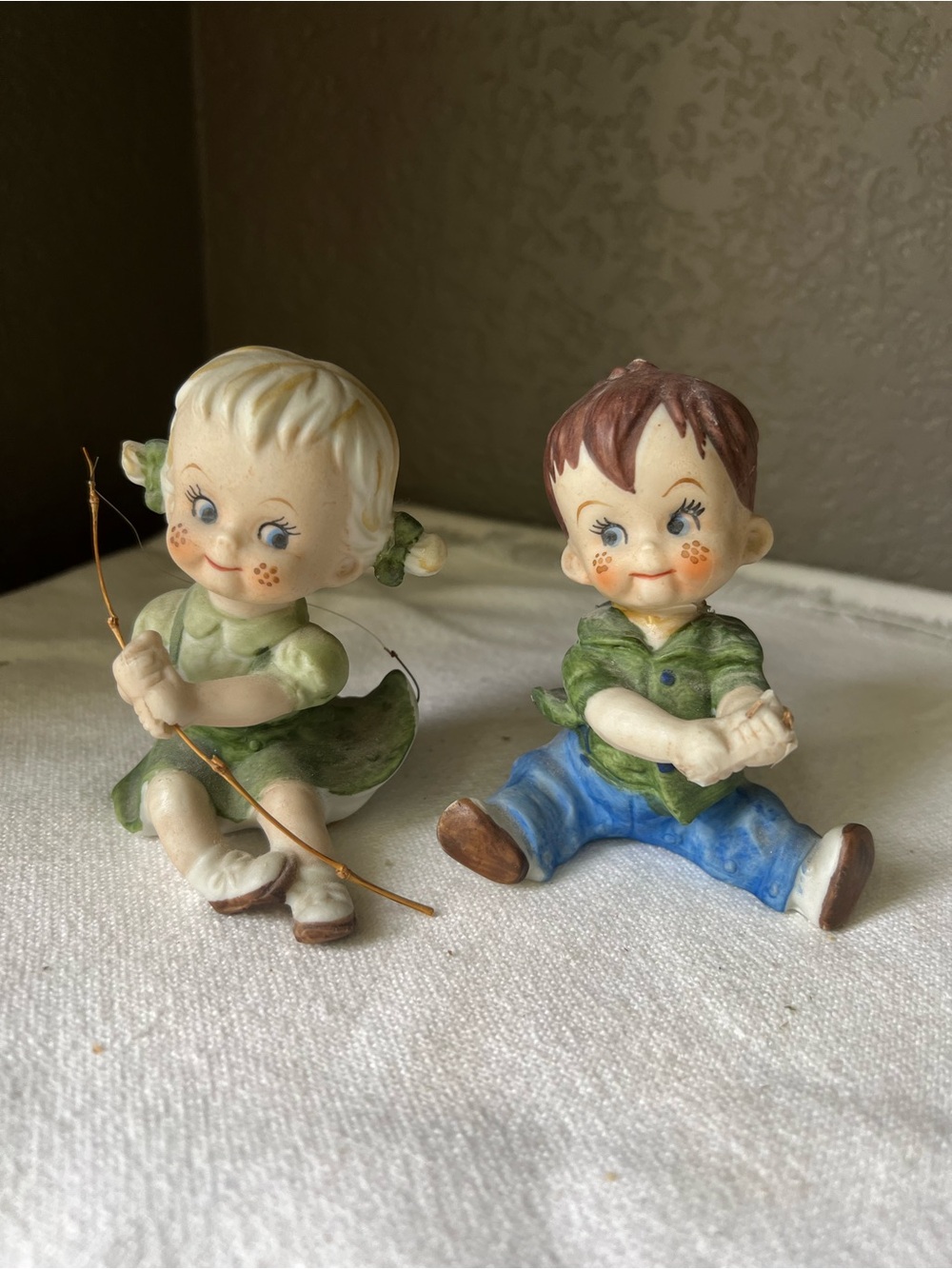 vintage Japanese porcelain figurines from the 1950s, boy and girl fishing